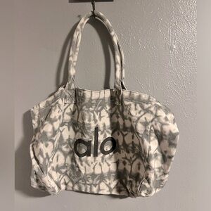 GUC gray and white Alo bag.